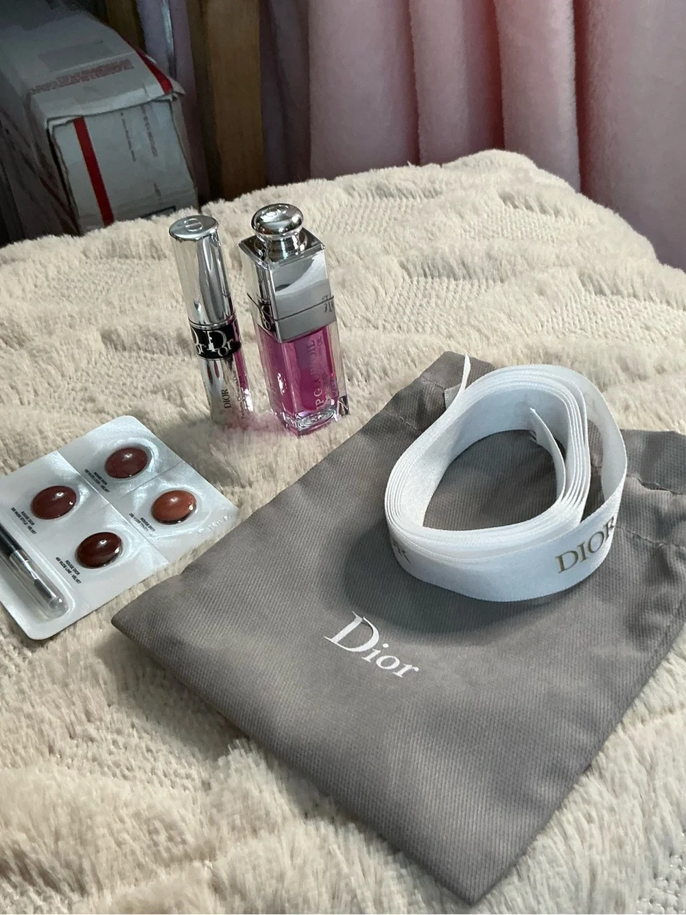 Dior White Logo Ribbon with Gray Pouch and Pink Lip Gloss Accent